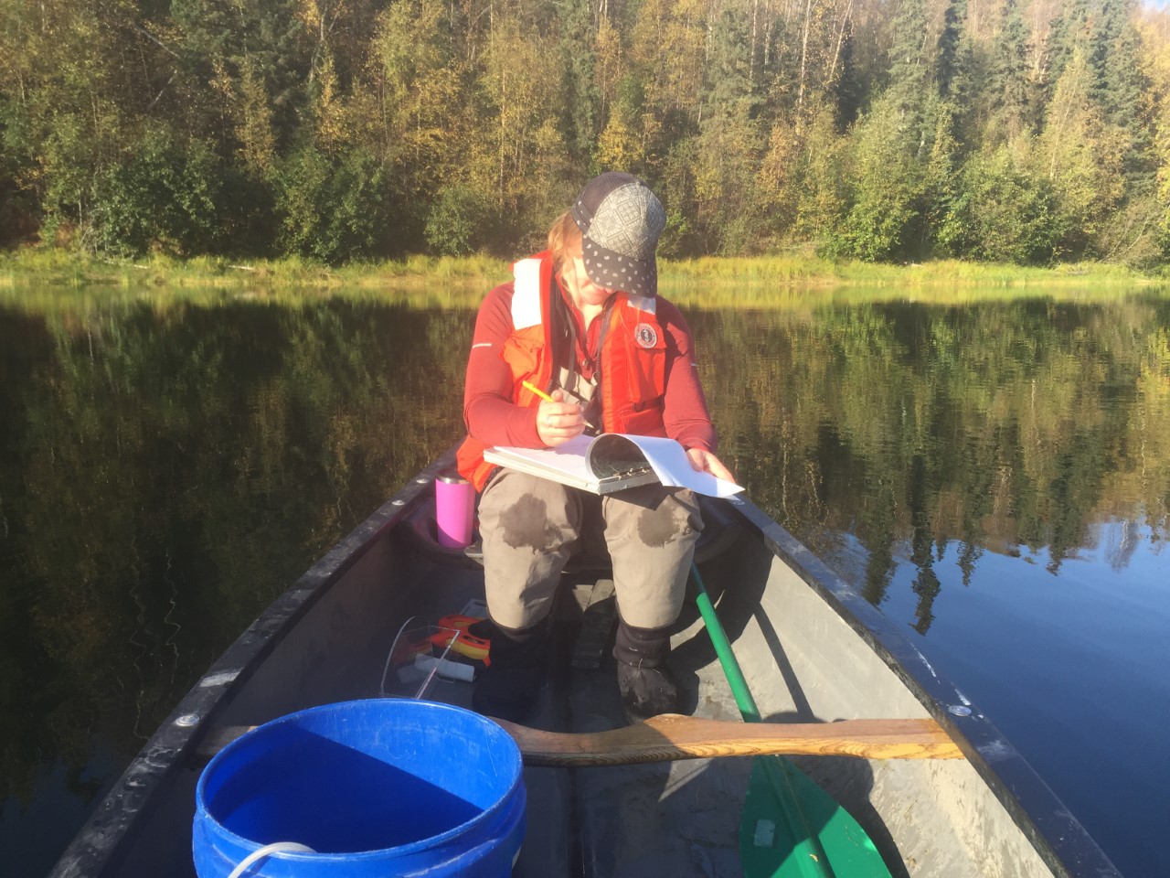 JBER team member taking data from canoe on Gwen Lake.